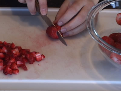 slicing dicing and mashing strawberries for delicious strawberry recipes Video